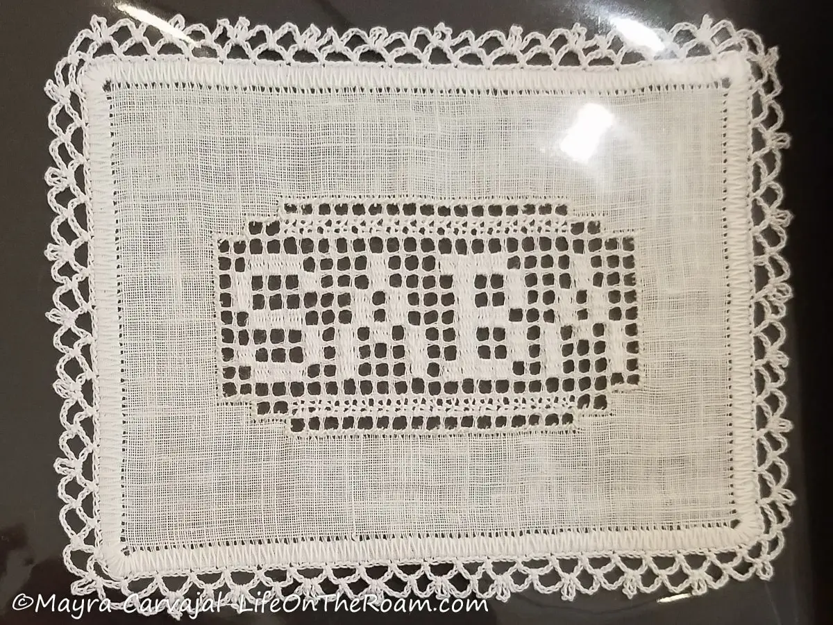 A drawn thread piece with the word "Saba"